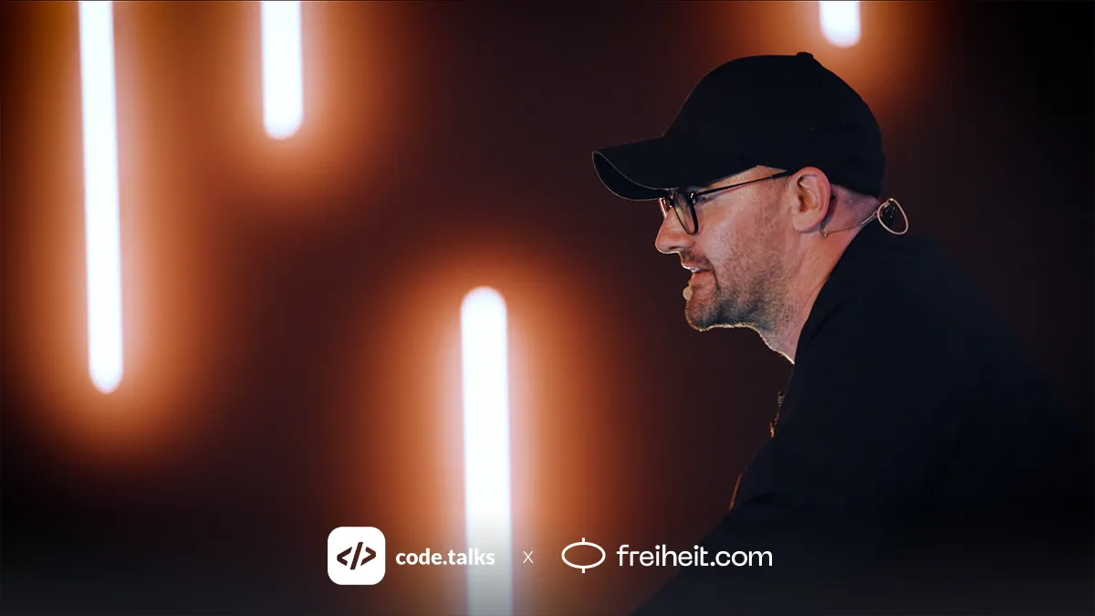 A freiheit.com engineers is talking about one of our large-scale software projects at code.talks 2025