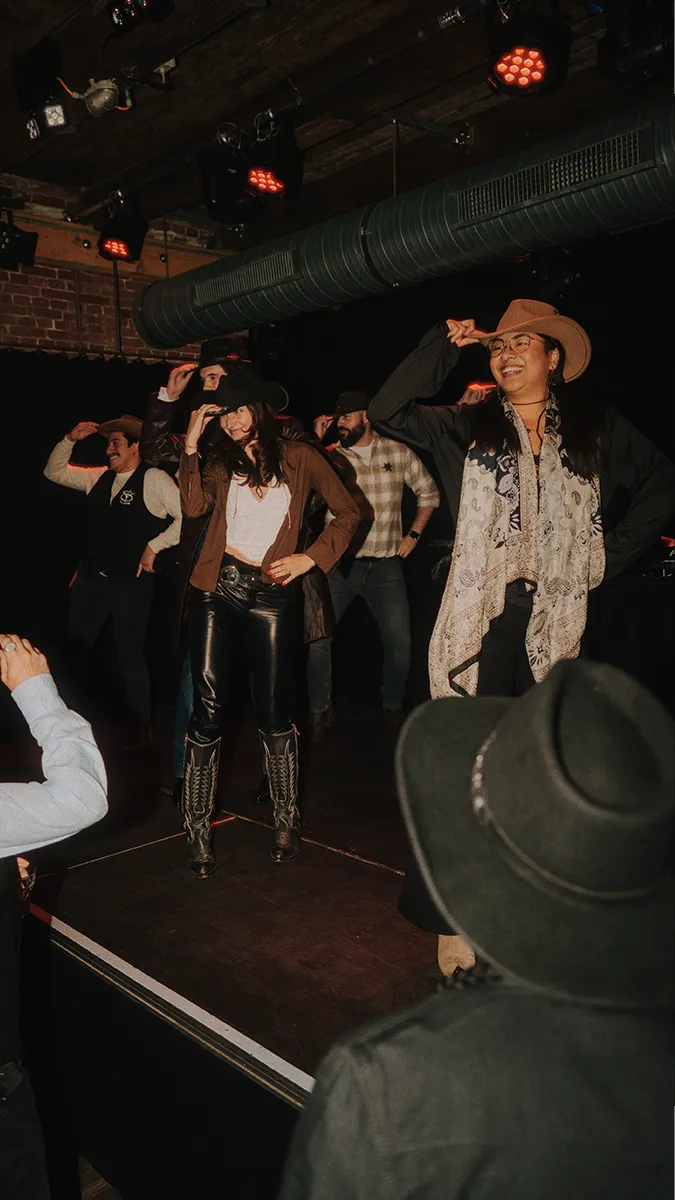 a group of freiheit.com members are dancing line dance at the xmas party