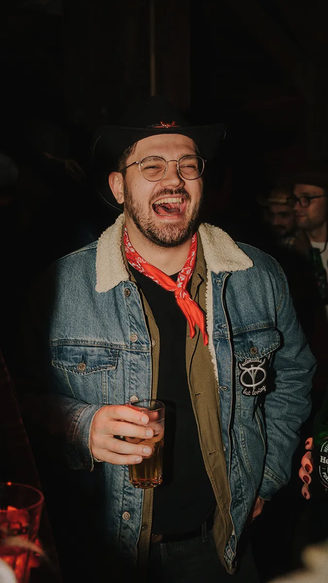 a freiheit.com member is laughting at the xmas party