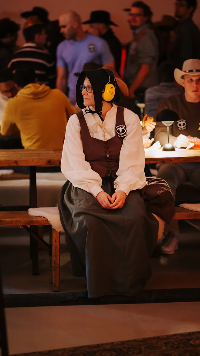 a freiheit.com member sitting at a table at the xmas party